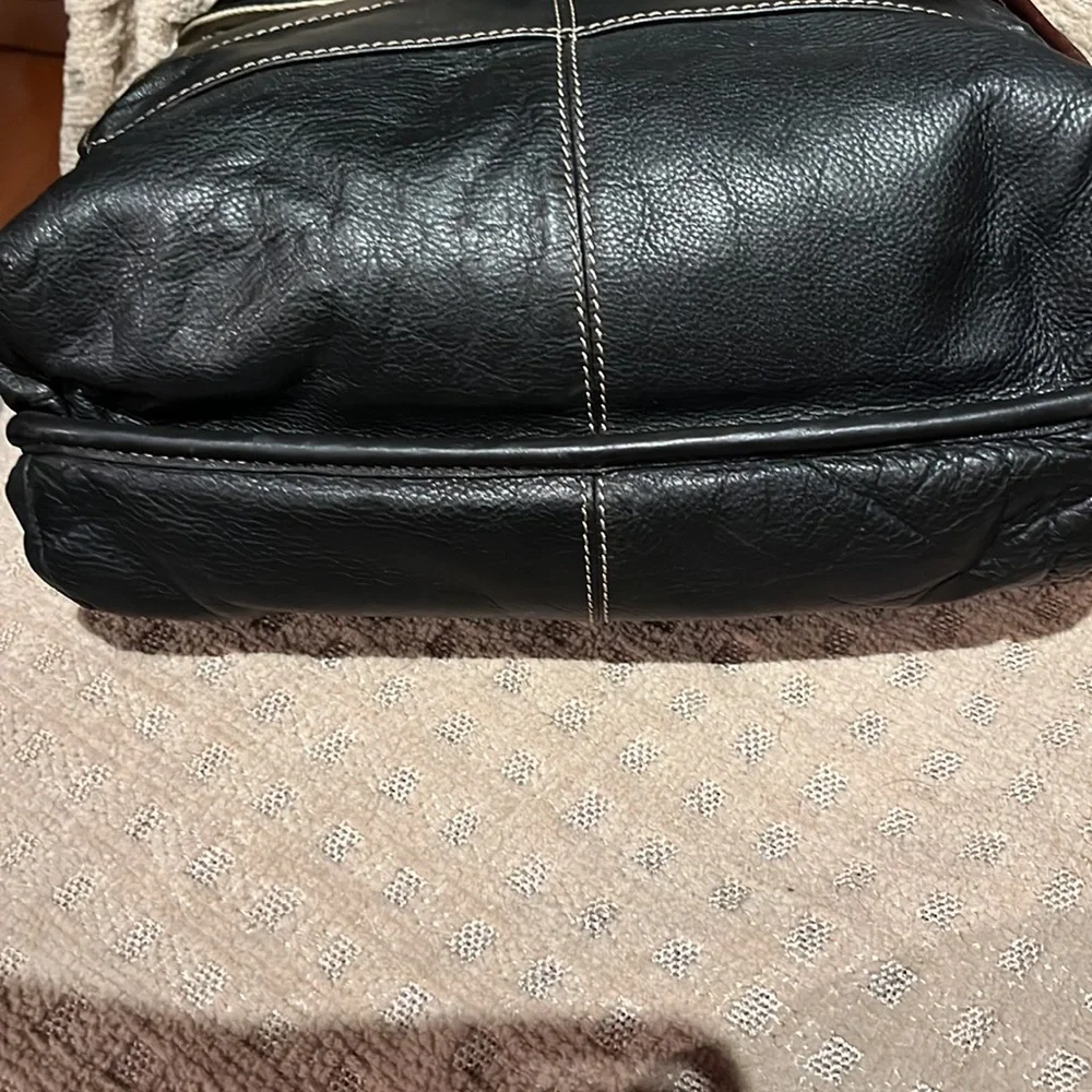 The territory ahead, black with brown leather trim, laptop bag